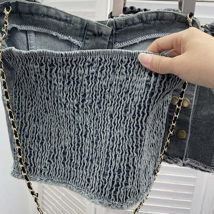 Denim Buckle Strapless Slim Fit Tank Top showing textured denim fabric and chain strap details hand-held for a stylish look.