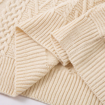 Diamond Pattern Jacquard Knit Sweater detail with textured cream knit fabric and ribbed cuffs.