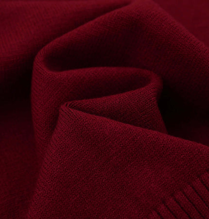 Embroidered Cable Knit VNeck Sweater close-up showing rich burgundy texture and soft fabric quality.