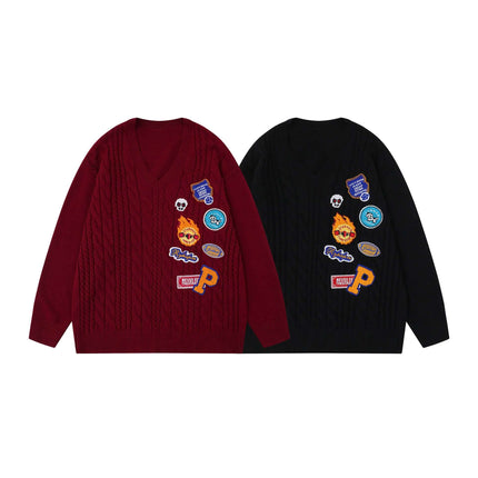 Embroidered Cable Knit VNeck Sweater in burgundy and black, featuring unique heavy embroidery and a textured cable-knit pattern.