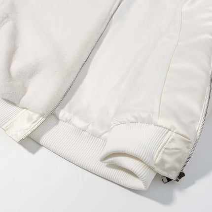 Detail of Faux Fur Hooded Winter Coat showing soft fabric, zipper closure, and ribbed cuffs.