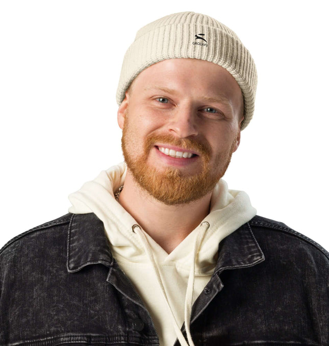 Grozavu beanie worn by a man in a smiley portrait, featuring a thick ribbed knit for warmth and style.