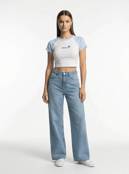 Model wearing White/Navy fitted ribbed crop top by Grozavu