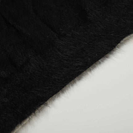 Fleece Letter Pullover Sweater – Loose Fit close-up showing texture and color contrast of black and white fabric.