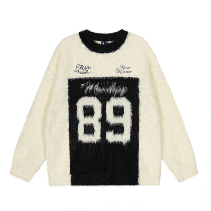 Fleece Letter Pullover Sweater – Loose Fit in cream with black letter graphics, round neckline, and relaxed fit.