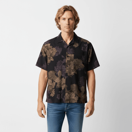 Floral Short Sleeve Shirt – Loose Fit in bold floral print on model, showcasing a relaxed vintage style.