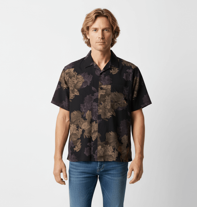 Floral Short Sleeve Shirt – Loose Fit in bold floral print on model, showcasing a relaxed vintage style.