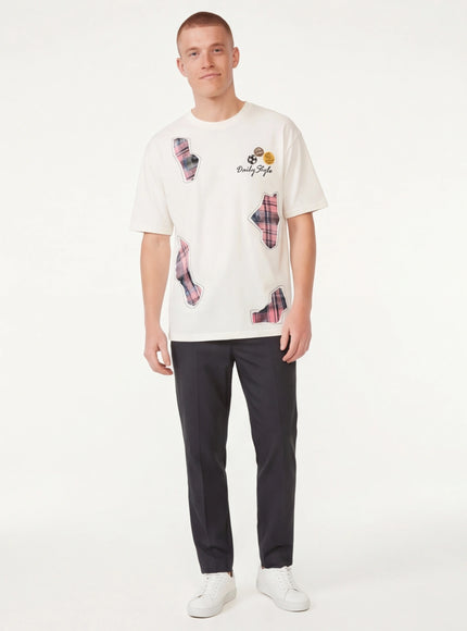 Model wearing Black applique badge graphic tee by Grozavu