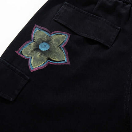 Pantalons en denim cargo imprimés graffiti