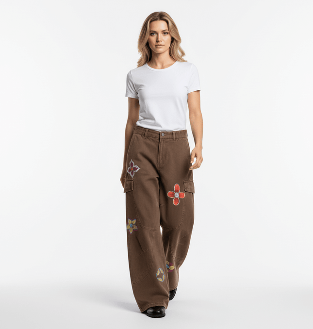 Photo of a model wearing Graffiti Printed Cargo Denim Pants with hand-painted flower designs.