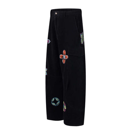 Graffiti Printed Cargo Denim Pants featuring hand-painted flower artwork and a stylish loose fit silhouette.