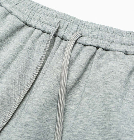 Close-up of the waistband and drawstring of Letter Print Casual Pants – Loose Fit in soft grey fabric.