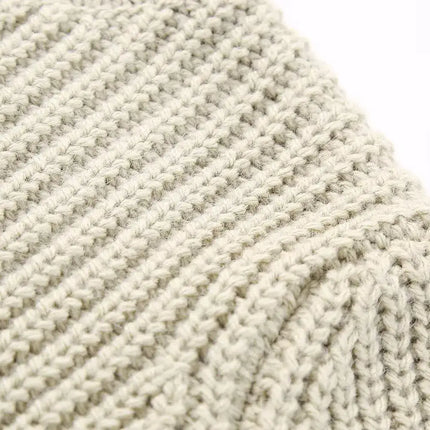 Close-up of the fabric texture of the Contrast Cropped Knit Sweater – Slim Fit showcasing ribbed knit pattern.