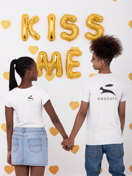 Back view of two models wearing white Grozavu T-shirts with black rabbit logo.