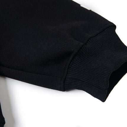 Close-up of the sleeve cuff of the Cross Embroidered Hoodie – Loose Fit, showcasing its high-quality fabric and design details.