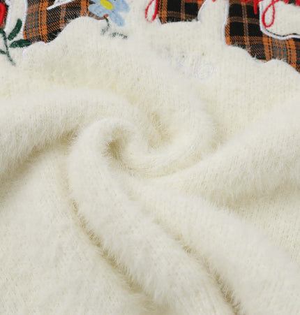 Knit Sweater with Letter Applique close-up featuring hand-stitched detail and soft textured fabric.