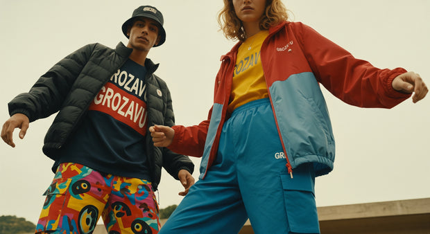 Stylish couple wearing matching Grozavu outfits in streetwear aesthetic