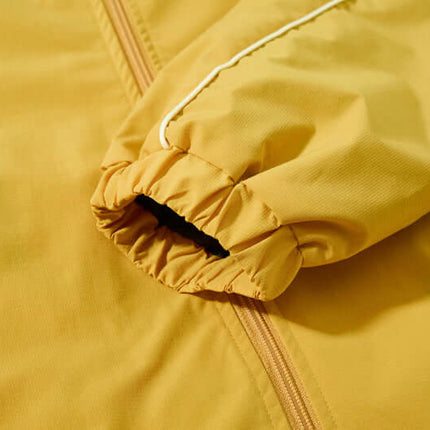 Close-up of the sleeve detail of the Retro Hooded Zip Jacket – Loose Fit in yellow fabric.