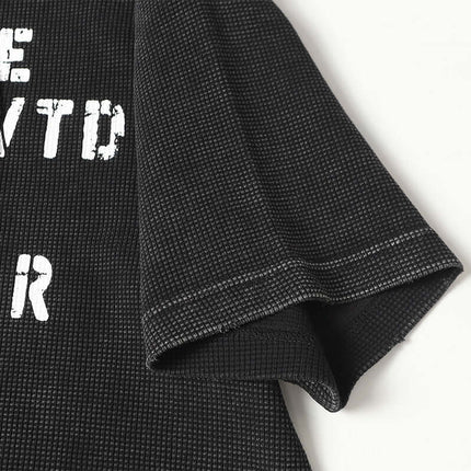 Close-up of the sleeve and textured fabric of the Retro Waffle Washed Cotton TShirt.