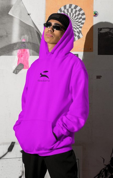 Unisex fuchsia Grozavu pullover hoodie with black rabbit logo in studio