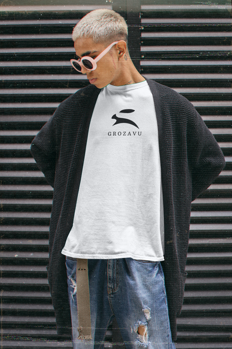 Close-up of white Grozavu T-shirt with rabbit logo under an open jacket