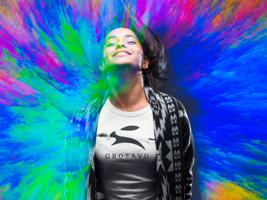 Woman in white Grozavu T-shirt with black rabbit logo, vibrant color-burst background