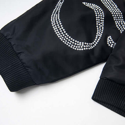 Detail of Hawk Embroidered Letter Hooded Coat showcasing bold embroidered design and sleek fabric texture.