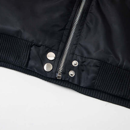 Close-up of the zipper and snap buttons on the Hawk Embroidered Letter Hooded Coat.