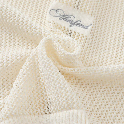 Close-up of the fabric texture of the Hooded Embroidered Knit Cardigan, showcasing its soft knit and label.