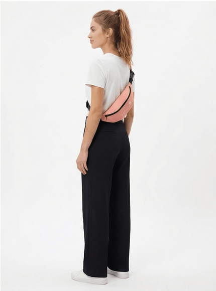 Model wearing utility crossbody bag by Grozavu