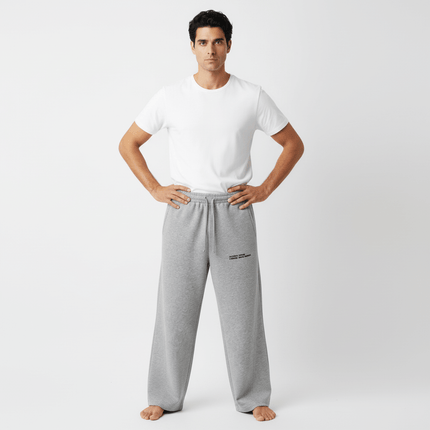 Letter Print Casual Pants – Loose Fit worn by a man in a white t-shirt and gray pants, showcasing a relaxed style.