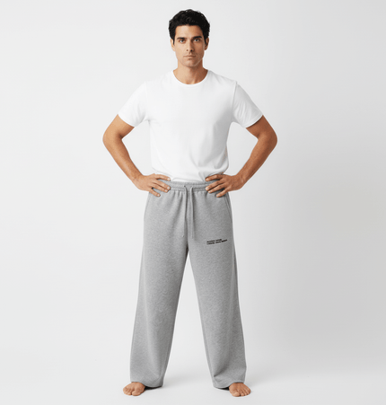 Letter Print Casual Pants – Loose Fit worn by a man in a white t-shirt and gray pants, showcasing a relaxed style.