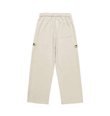 Letter Print Casual Pants – Loose Fit in beige, featuring an elastic waistband and side pockets.