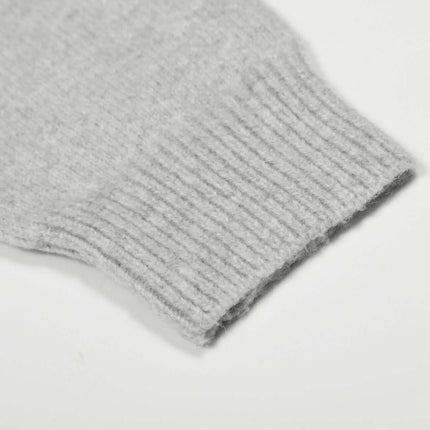 Loose Buttoned Turn Down Collar Sweater sleeve detail showcasing ribbed cuff design.
