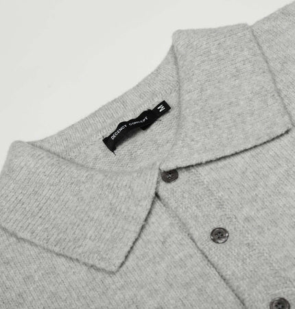 Loose Buttoned Turn Down Collar Sweater in soft gray fabric with buttons and stylish collar detail.