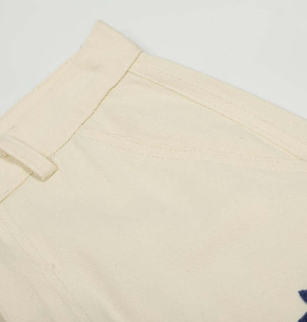 Loose Fit Cartoon Patchwork Pants close-up, featuring patchwork detailing and playful embroidery.