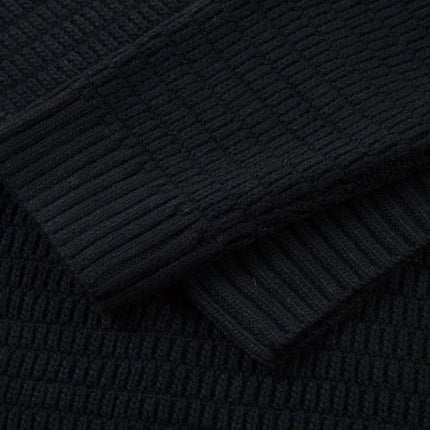 Loose Fit Plain Knit Sweater in textured black fabric with ribbed cuffs for casual streetwear fashion.