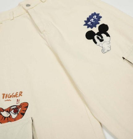 Loose Fit Cartoon Patchwork Pants featuring colorful cartoon embroidery and playful patchwork details.