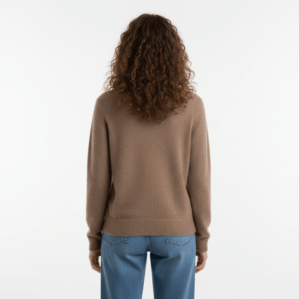Back view of a woman wearing a Simple Loose Knit VNeck Top in camel color, showcasing its relaxed fit and long sleeves.