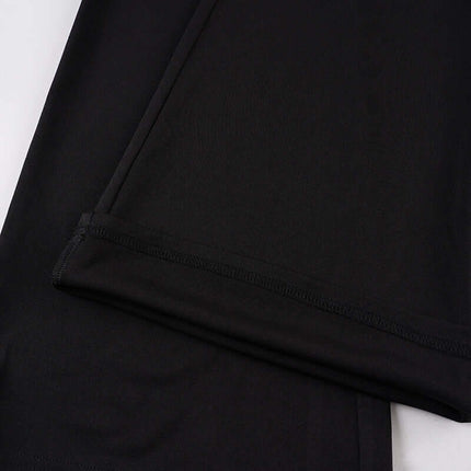 Close-up of the fabric texture of the Low-Waist Flared Leggings – Slim Fit in black.