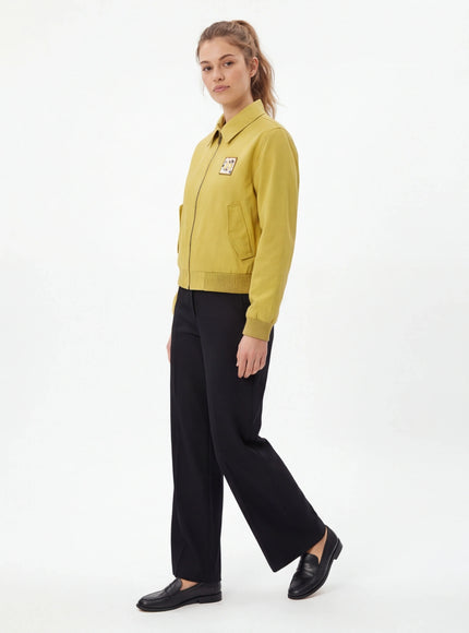 Model wearing Apricot cropped tailored jacket by Grozavu