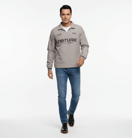 Man wearing Long Sleeve Tactical TShirt with nature design, walking confidently on a plain background.