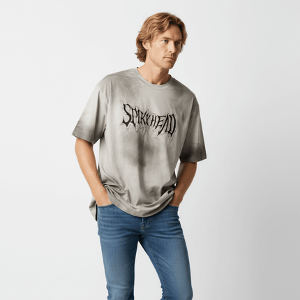 Patch Embroidery TShirt – Loose Fit worn by a man with relaxed style and trendy drop-shoulder design.