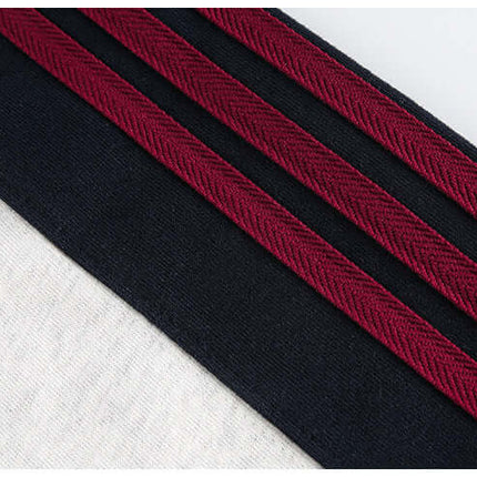 Close-up of National Trend Retro Stripe Loose Shirt featuring bold retro stripes in black and burgundy fabrics.