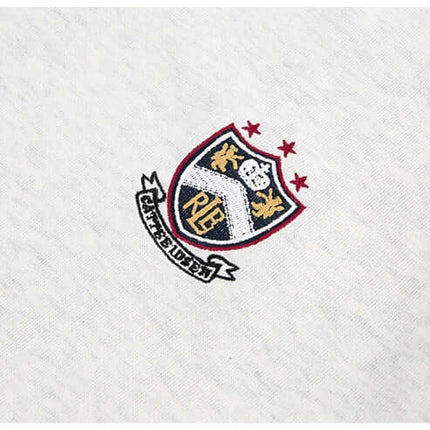 National Trend Retro Stripe Loose Shirt logo embroidered on fabric with shield design and stars.