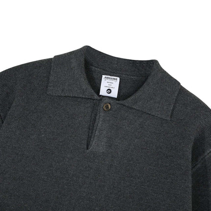 Notch Lapel Knit Sweater - Loose Fit in dark gray with a flip collar neckline and a button detail.