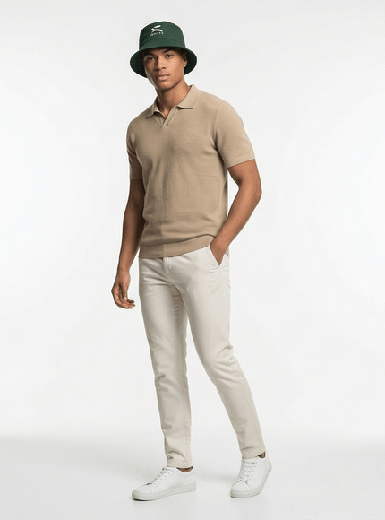 Model wearing reversible bucket hat by Grozavu