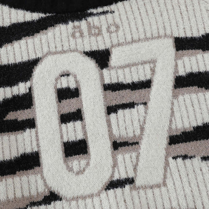 One-Shoulder Striped Knit Sweater – Slim Fit close-up showing striped pattern and number 07 detail.