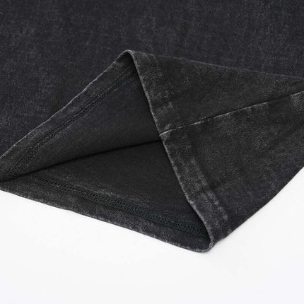 Close-up of the hem detail of an Oversized Printed Sleeveless Tank Top showing the soft cotton fabric.