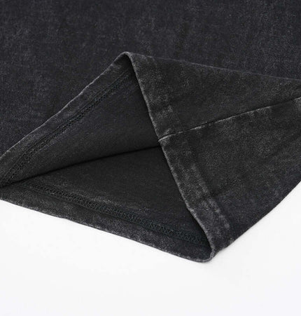 Close-up of the hem detail of an Oversized Printed Sleeveless Tank Top showing the soft cotton fabric.